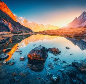 Illuminated Peaks Above a Mountain Lake