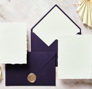 Wedding Flat Lay with Purple Envelopes